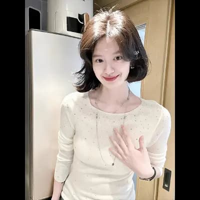 Core-spun yarn fabric, rhinestone-embellished knitted base layer top for women.